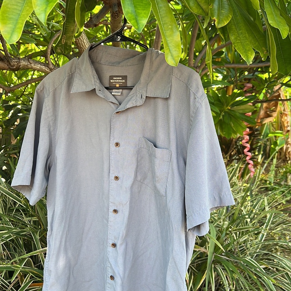 Quicksilver Waterman button down size medium bluish/gray shirt.